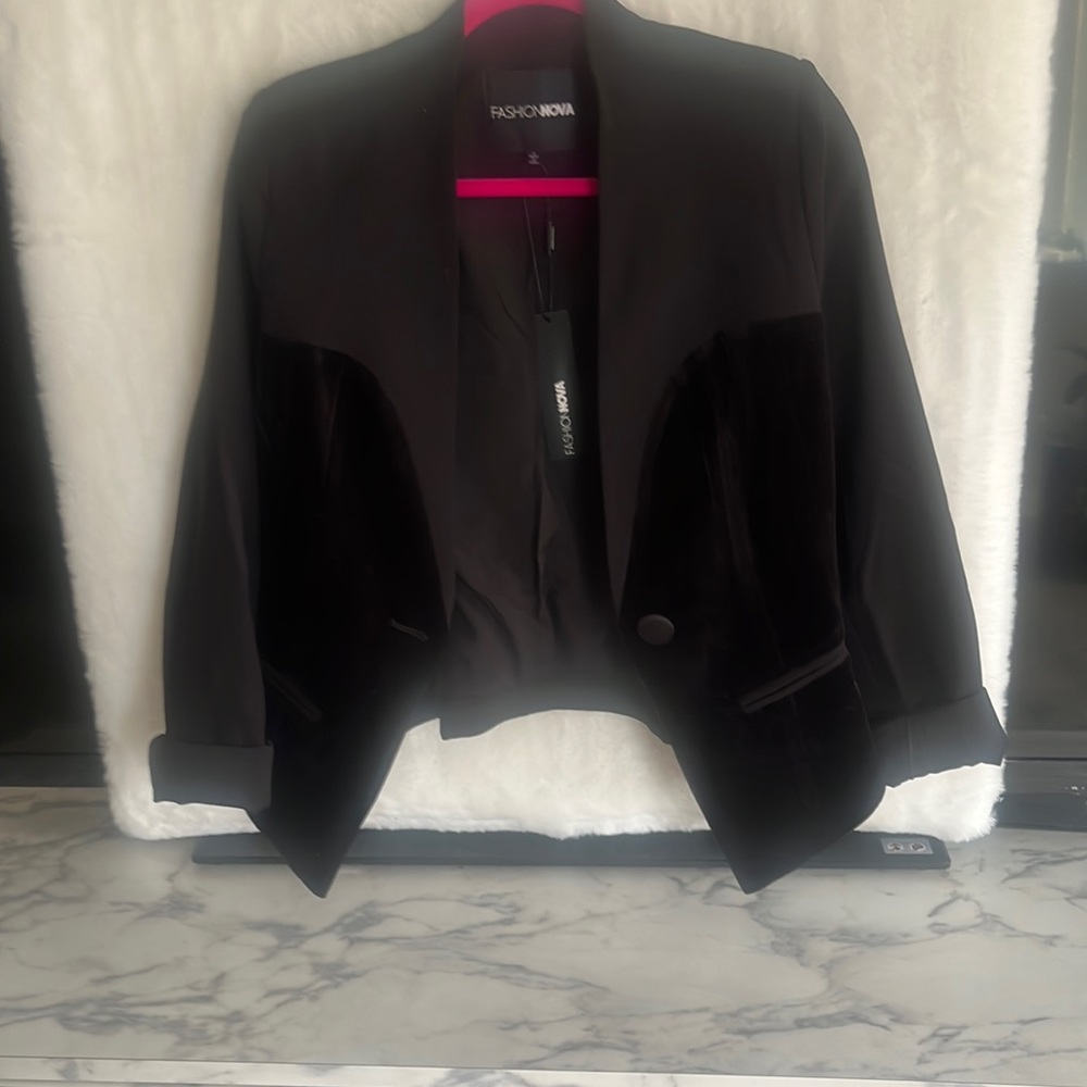 Black tuxedo like velvet, long sleeve, jacket with one button to close